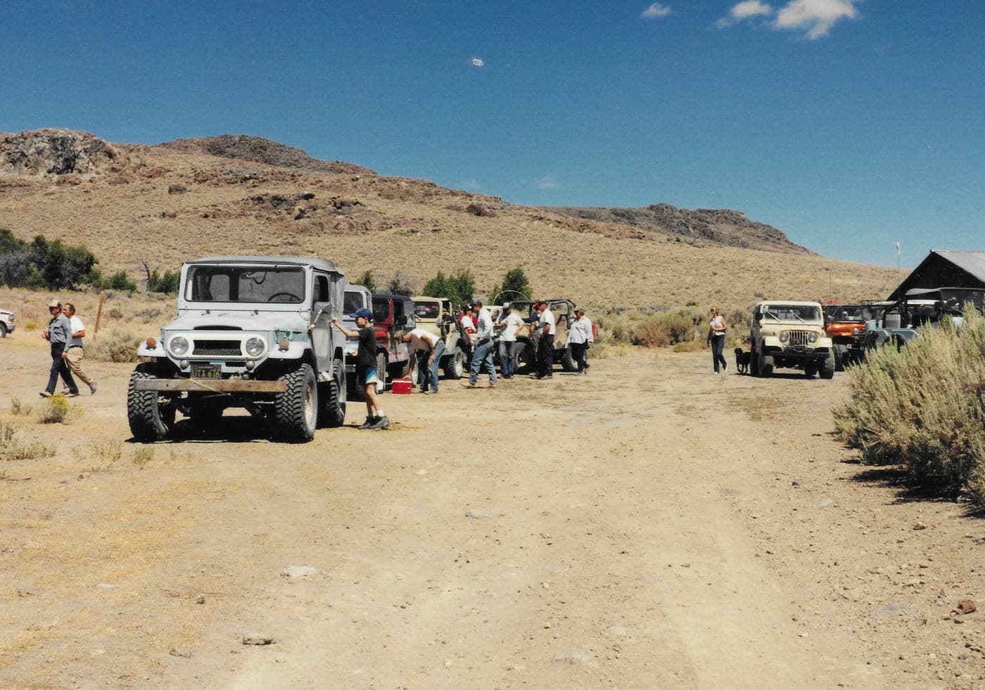 Club members and their four-wheel drives gathered at a camp