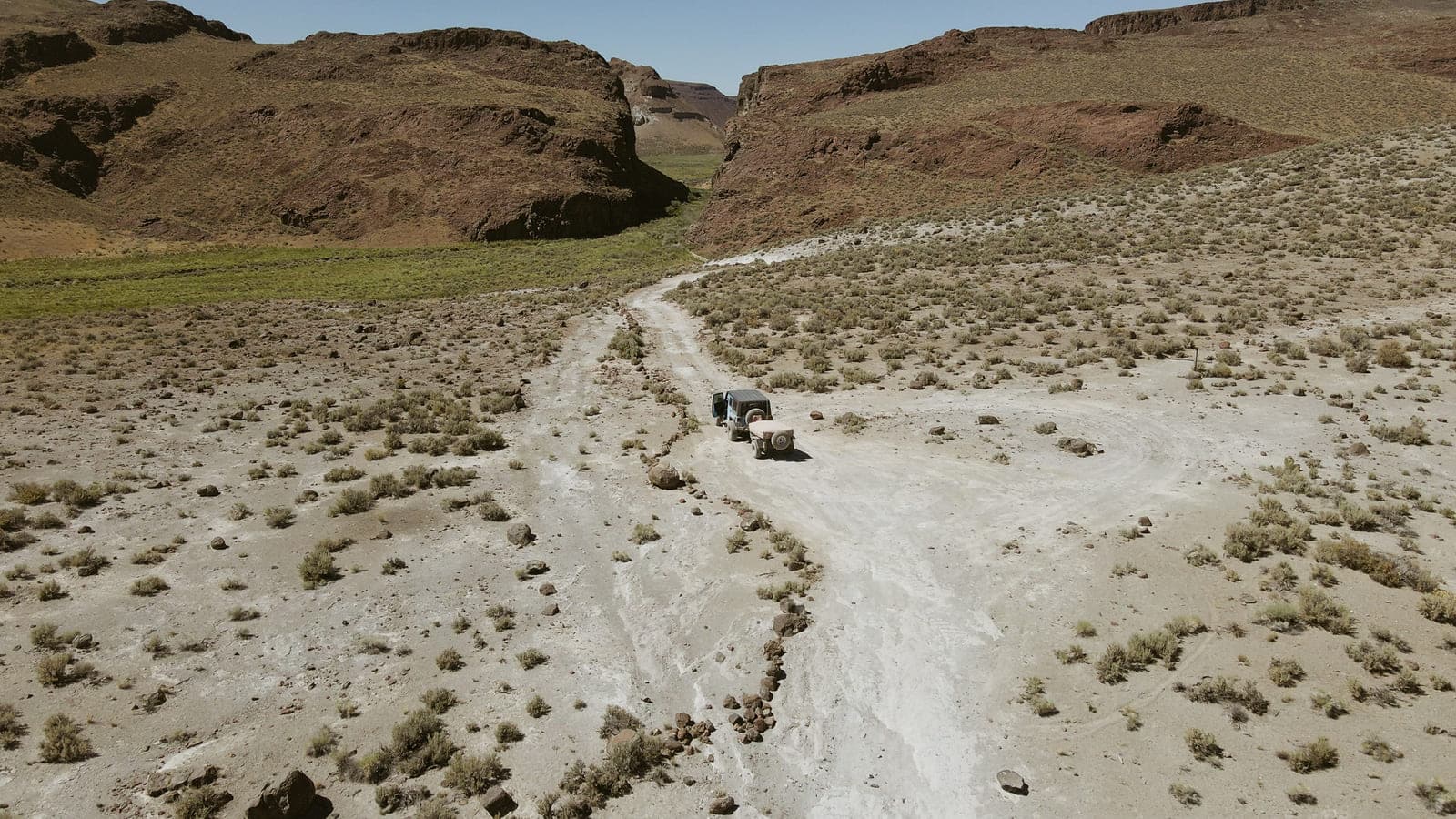 Aerial view of a Jeep on the track leading into the mouth of High Rock Canyon